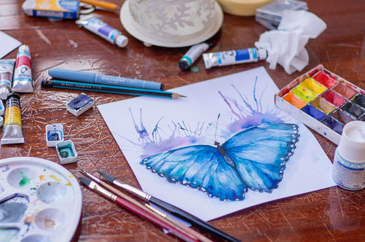 Vibrant butterfly watercolor painting showing transparent washes on textured paper