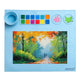 ARTIOS blue silicone painting mat with 12 paint wells, collapsible brush cleaner cup and 2 mixing circles, autumn forest painting displayed on the mat surface