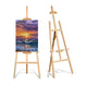 Two ARTIOS 5 foot wooden floor easels, one with vibrant sunset seascape painting and one empty, natural pine, white background