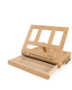 ARTIOS desk box easel open at angle showing adjustable easel back and storage drawer, natural beech wood finish