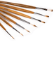 Seven ARTIOS paint brushes with wooden handles fanned diagonally, showing mixed round and flat bristle tips on white background